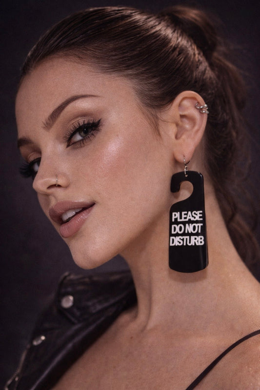 Model wearing funny statement earrings UK