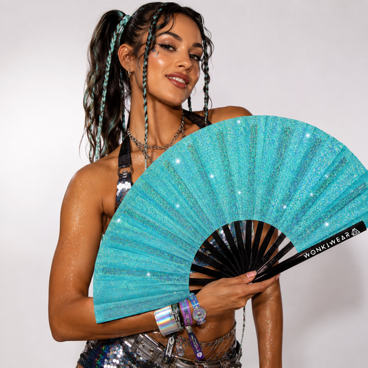 Festival model holding Frost Kiss light blue glitter festival fan