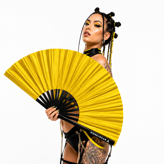 Festival model holding XL gold shimmer metallic festival fan