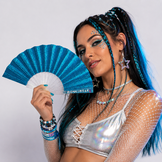 Studio photoshoot featuring blue glitter folding festival fan