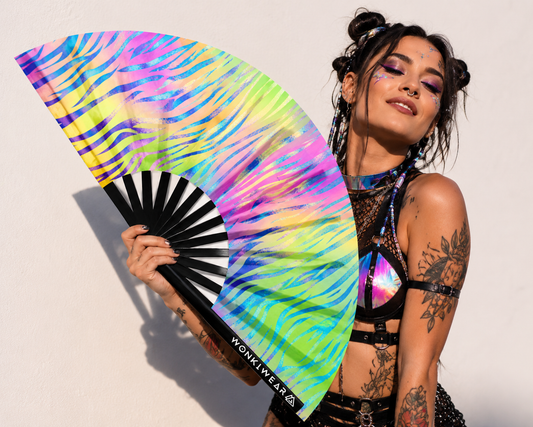 Festival model holding XL UV reactive pastel zebra rave fan