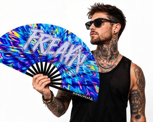 Male festival model holding XL UV reactive FREAKY rave fan