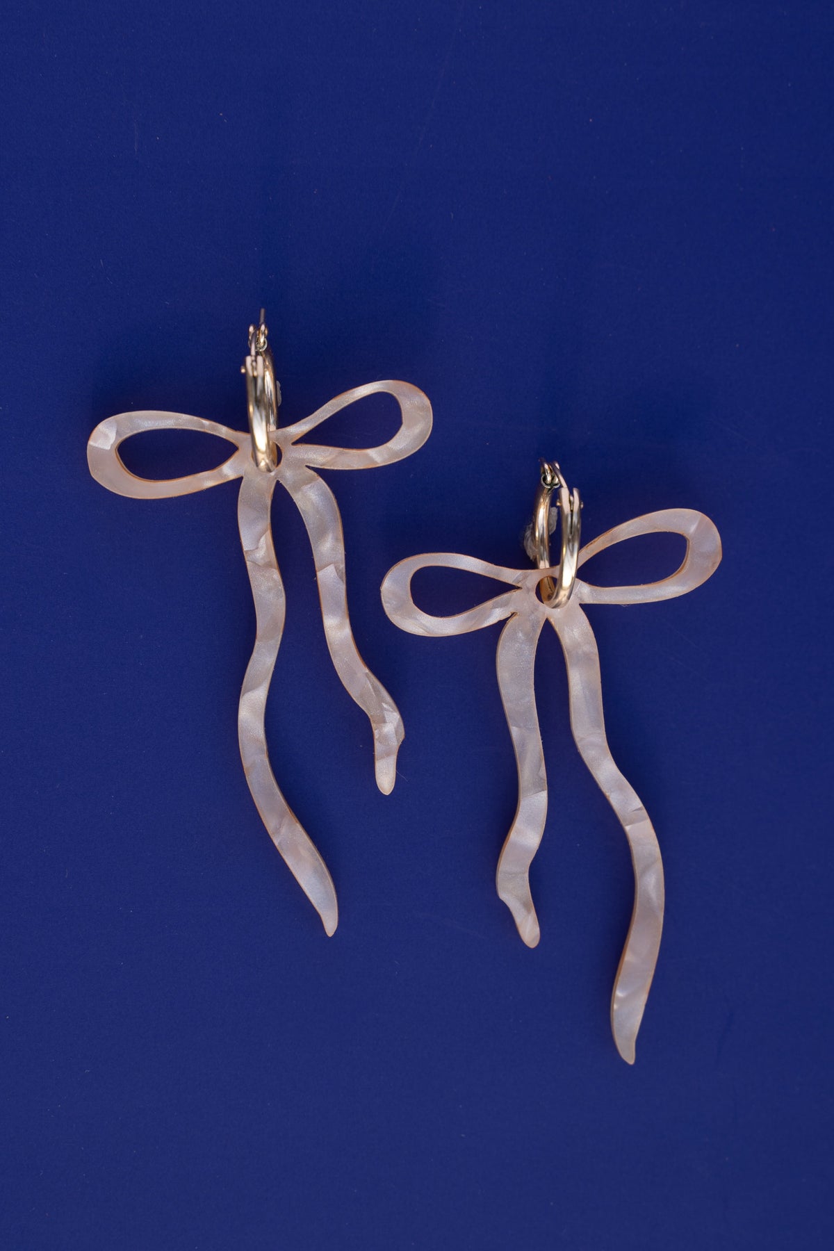 Pearlescent Beige Dangly Bow Hoop Earrings | Bow Jewellery