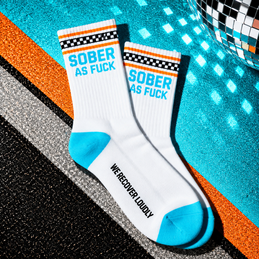 Sober AF white statement socks with cyan heel and toe, orange stripes and checkerboard cuff
