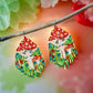 Handmade beaded earrings with a woodland mushroom design, featuring a red mushroom cap. Mounted on surgical steel lever backs.