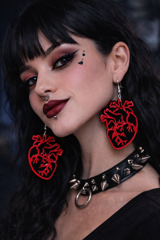 Model wearing anatomical heart earrings alternative styling UK