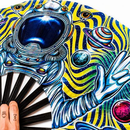 Close-up of astronaut and galaxy artwork printed on silky festival fan fabric