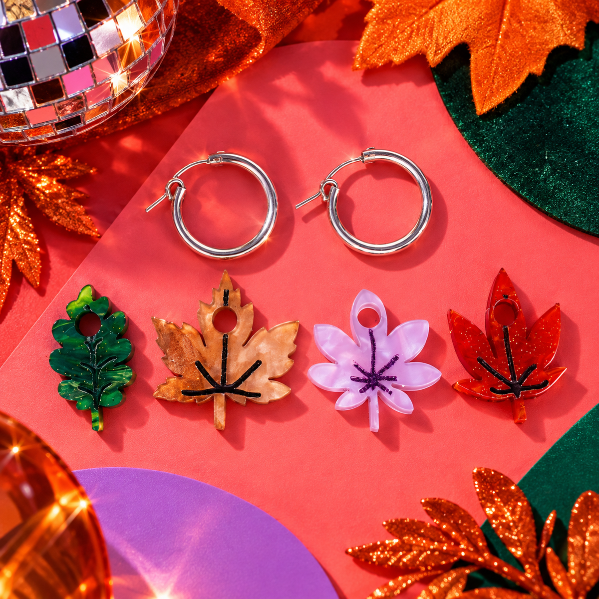 Autumnal Leaves hoop earrings with four colourful hand-painted leaf charms by Cuteryko