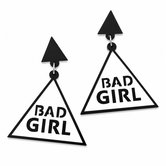 Black and white BAD GIRL statement drop earrings on white background