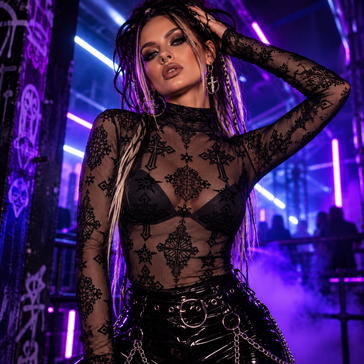 Black cross flocking mesh top styled with PVC trousers at an underground neon techno rave