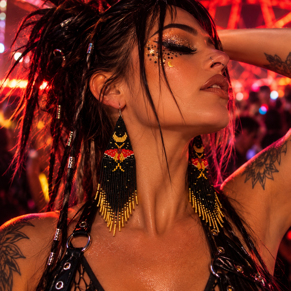 Woman wearing black, red and gold beaded moth fringe earrings at a neon rave festival