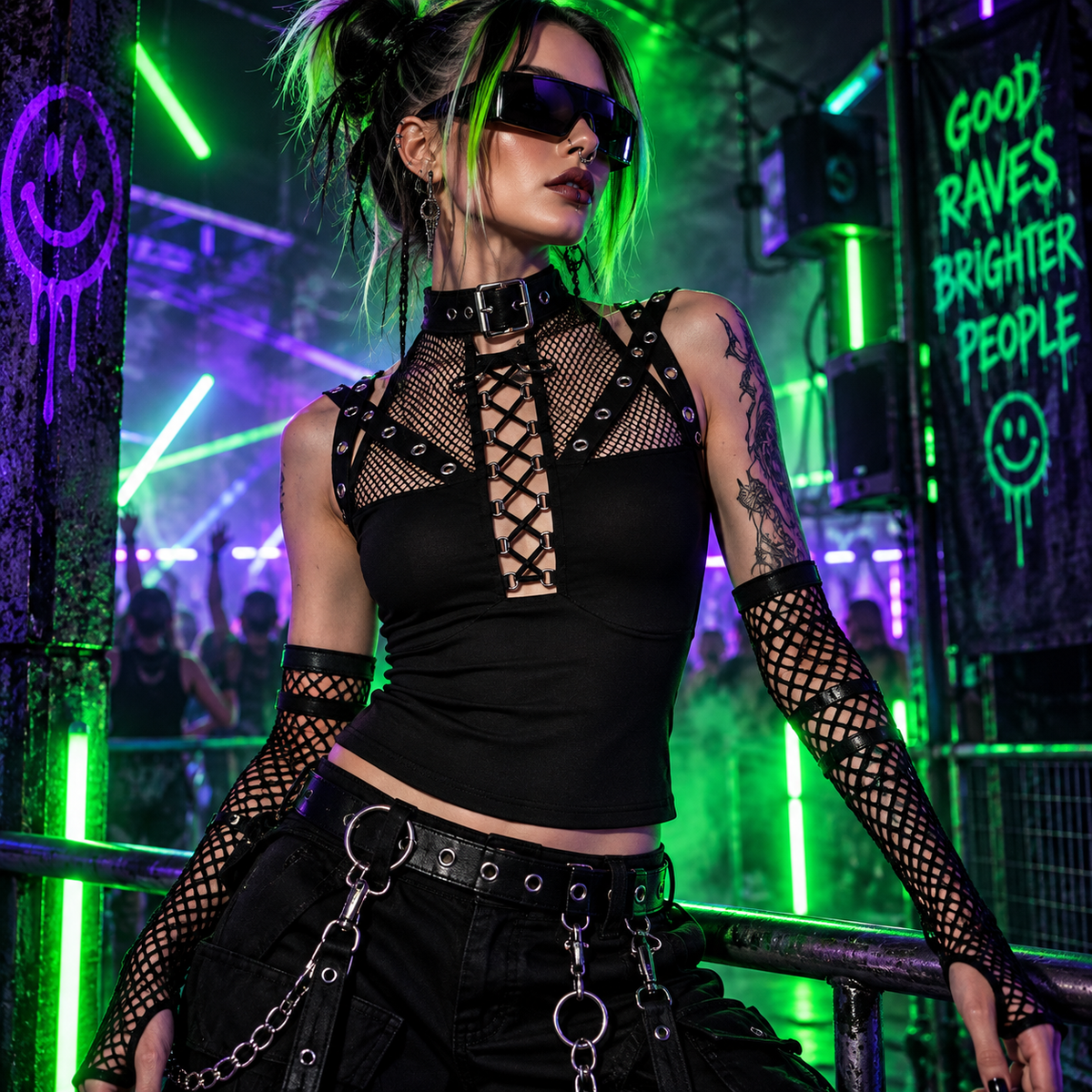 Black mesh strap rave top styled with neon cyber-goth clothing at an underground techno rave