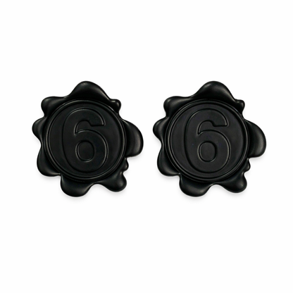 Matte black number 6 statement stud earrings on white background