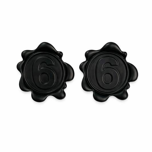 Matte black number 6 statement stud earrings on white background