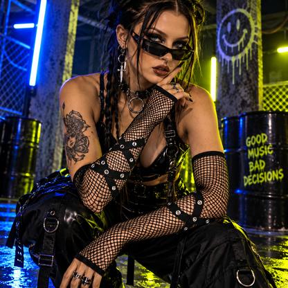 Black punk mesh chain rave gloves with hardware strap detailing styled at an underground techno rave