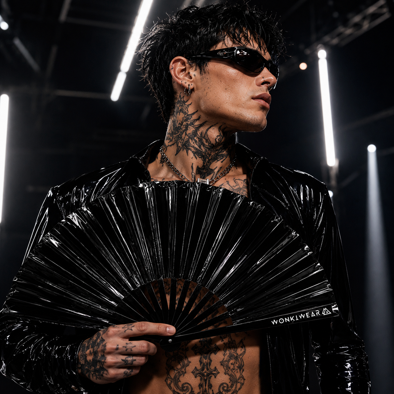 Male festival model with XL Black Raven glossy rave hand fan