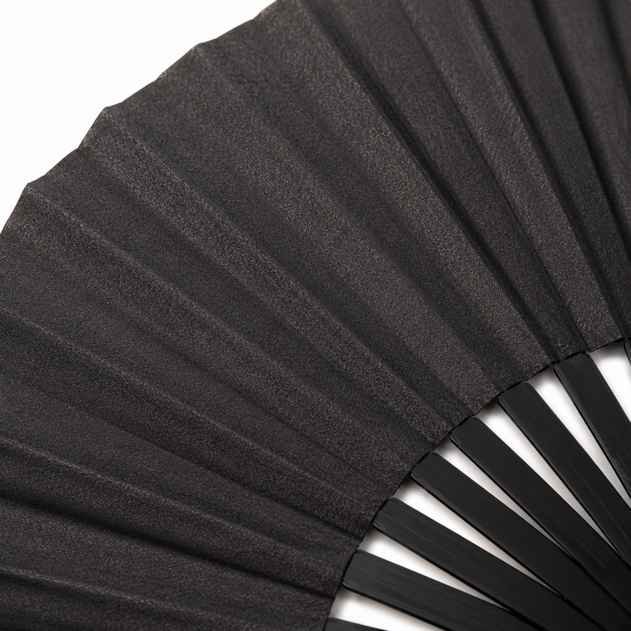 Macro close-up showing the subtle shimmer finish of the black metallic festival fan