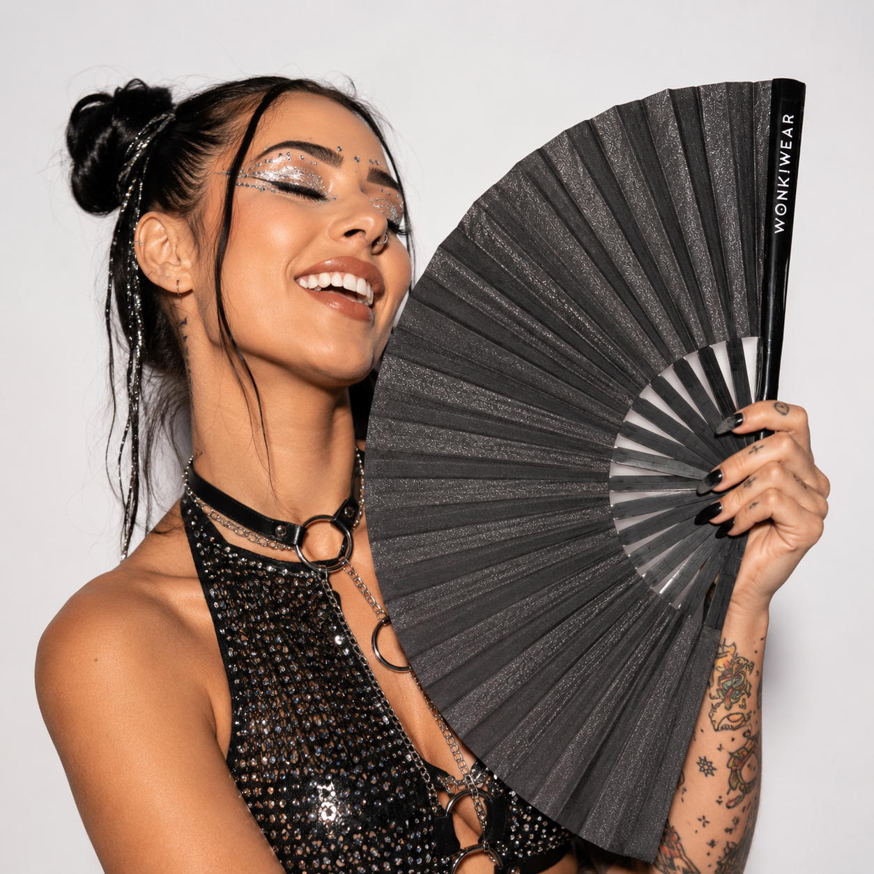 Festival model holding XL black shimmer festival fan
