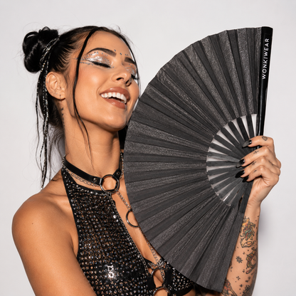 Festival model holding XL black shimmer festival fan
