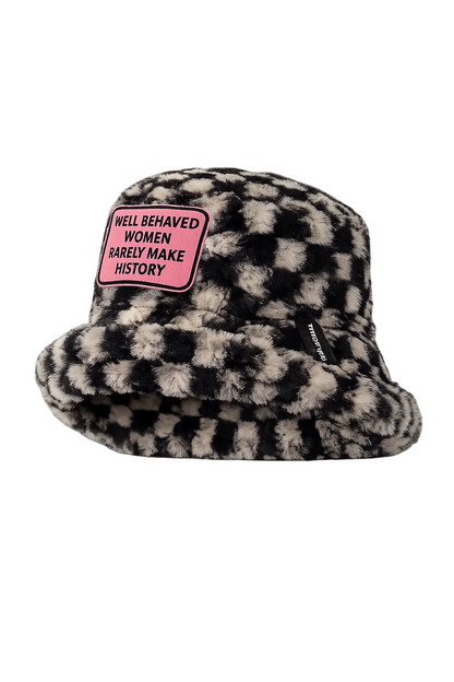 Side view of handmade black and white chequered furry bucket hat