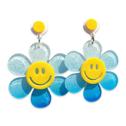 Oversized blue glitter daisy statement earrings with smiley flower centre