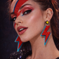 Model wearing lightning bolt earrings glam rock style