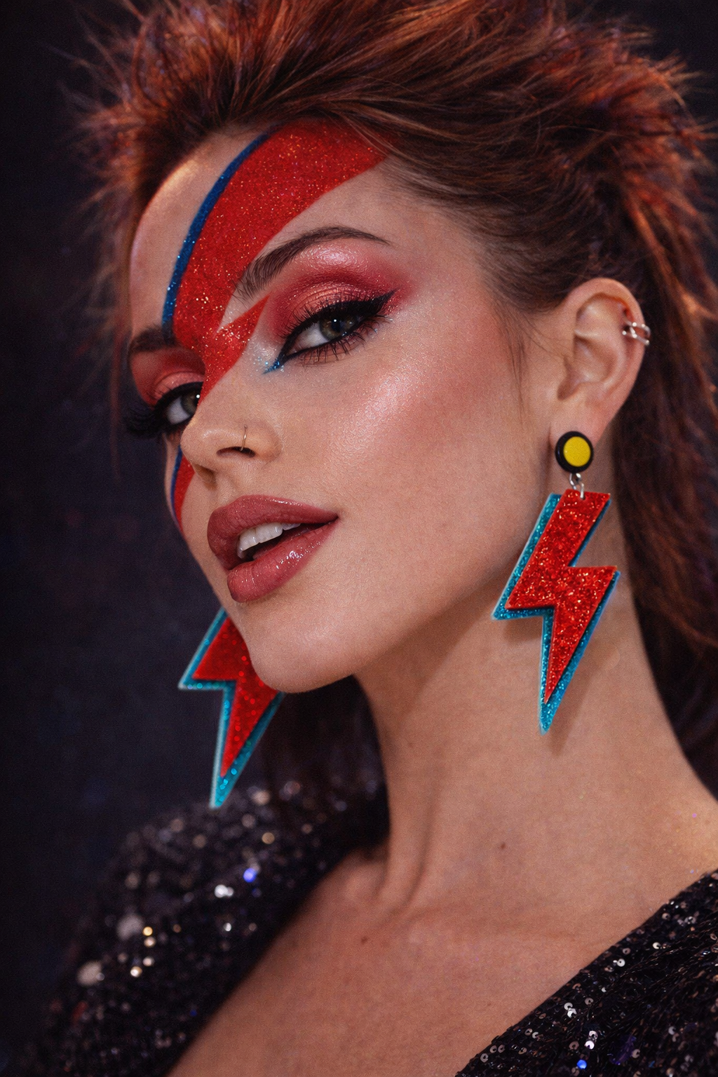 Model wearing lightning bolt earrings glam rock style