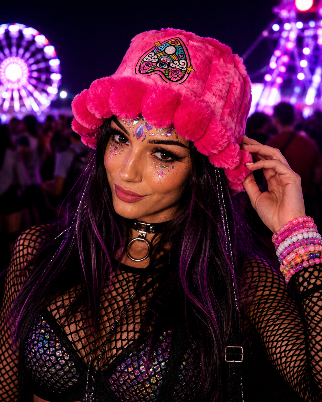 Festival model wearing bright pink psychedelic furry bucket hat at rave by WonkiWear