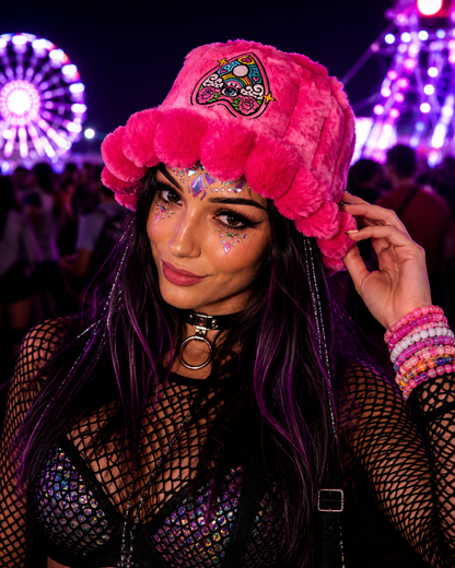 Festival model wearing bright pink psychedelic furry bucket hat at rave by WonkiWear