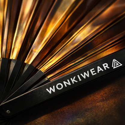 Close up of bronze iridescent fan showing reflective metallic finish and WonkiWear branding