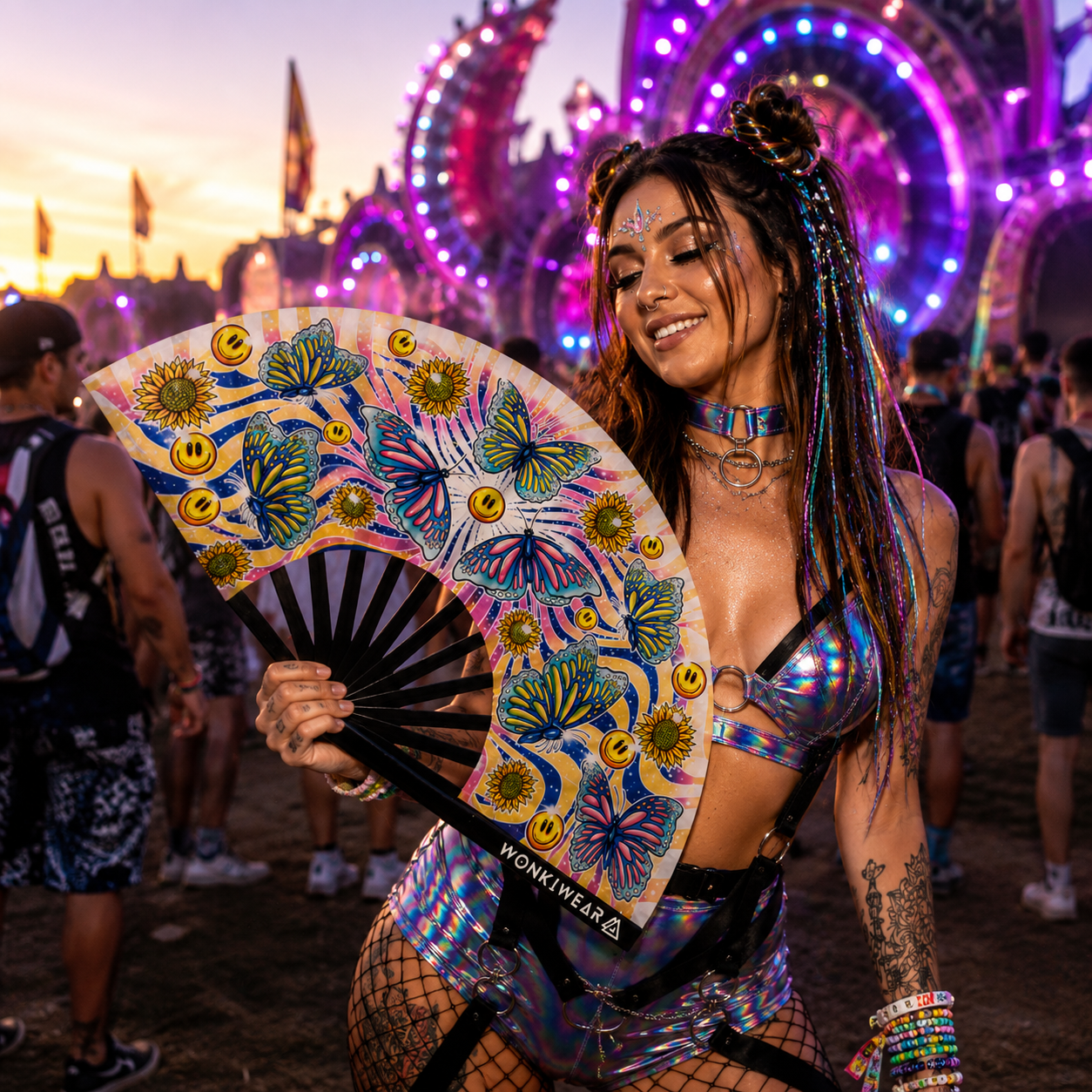 Festival model using XL Butterfly Haven festival fan at outdoor music festival