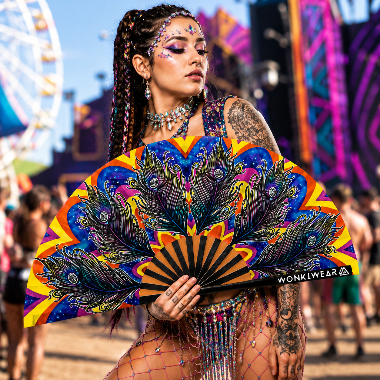Festival-goer using Carnival XL festival fan at outdoor music festival