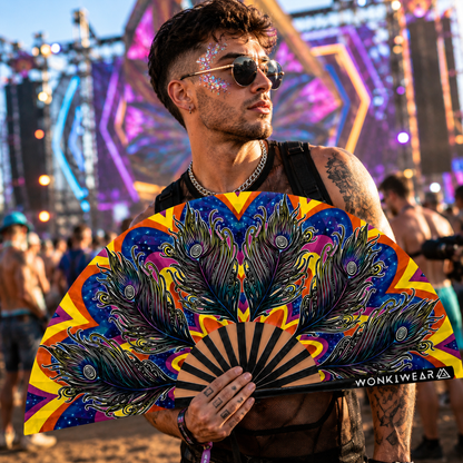 Male festival model holding Carnival XL peacock feather festival fan