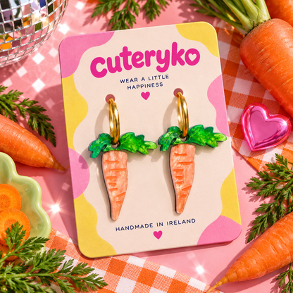 Carrot hoop earrings with glittery orange carrot charms and green leafy tops by Cuteryko