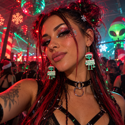 Woman wearing green Christmas alien “I Believe in Santa” statement earrings at a festive rave