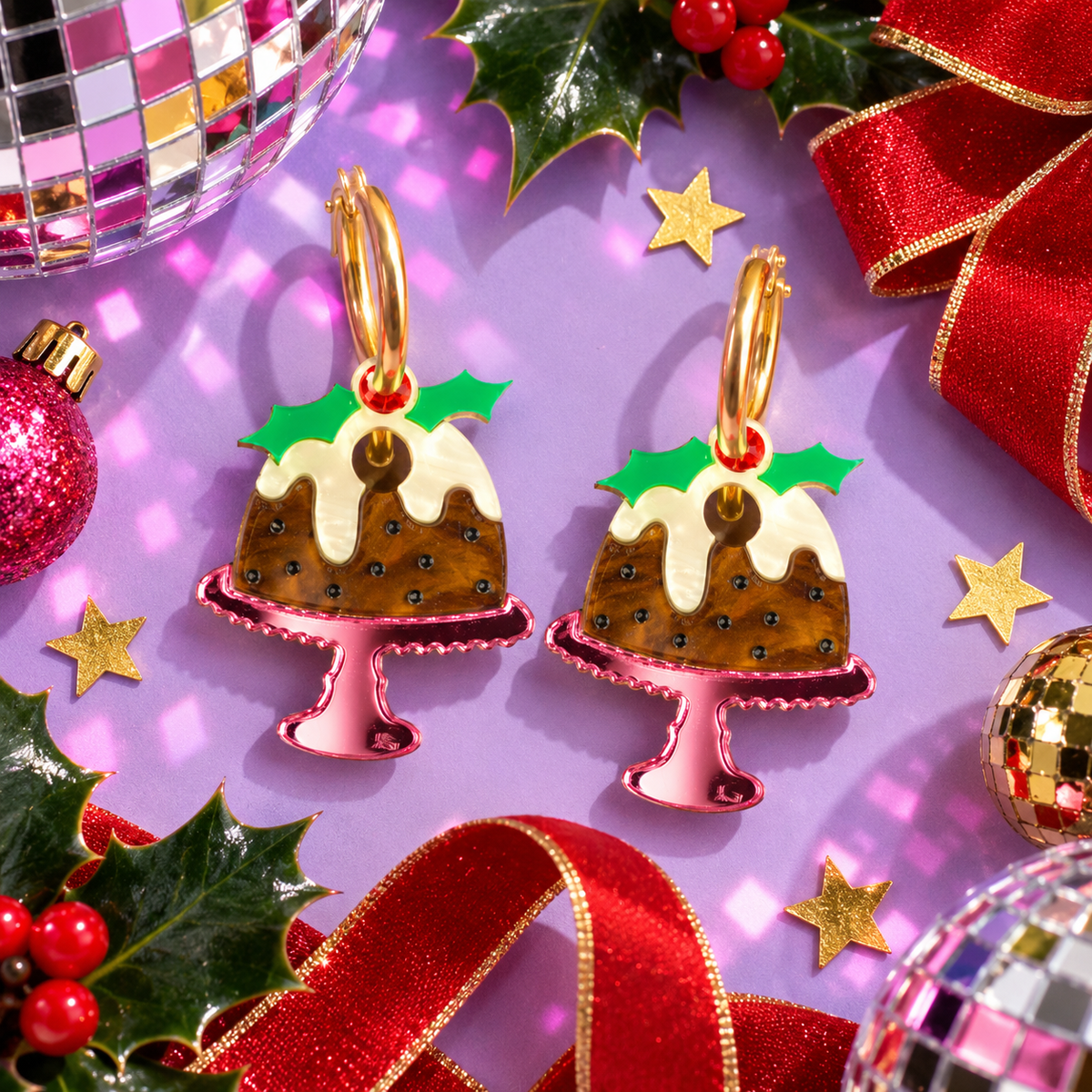 Christmas Pudding Hoop Earrings with holly, icing and red berries on pink cake stands by Cuteryko