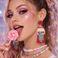 Model wearing gumball earrings cute festival outfit UK