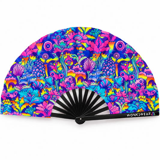WonkiWear Cosmic Bloom XL folding rave fan with vibrant psychedelic floral artwork in pink, blue, purple and yellow, black ribs and WonkiWear logo on the outer rib, displayed open against a white background.
