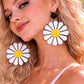 Model wearing daisy earrings summer festival styling UK