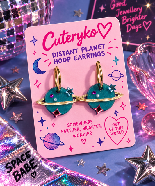 Distant Planet hoop earrings with teal blue ringed planet charms and gold hoops by Cuteryko