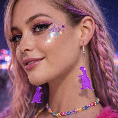 Model wearing purple dinosaur earrings festival rave outfit UK