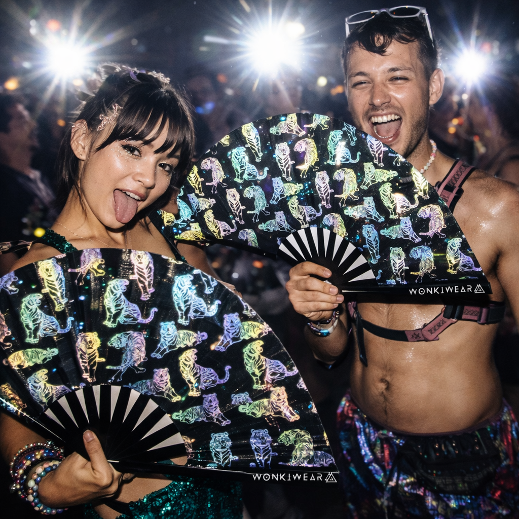 Festival couple holding rainbow reflective tiger rave fans glowing under flash photography at a rave