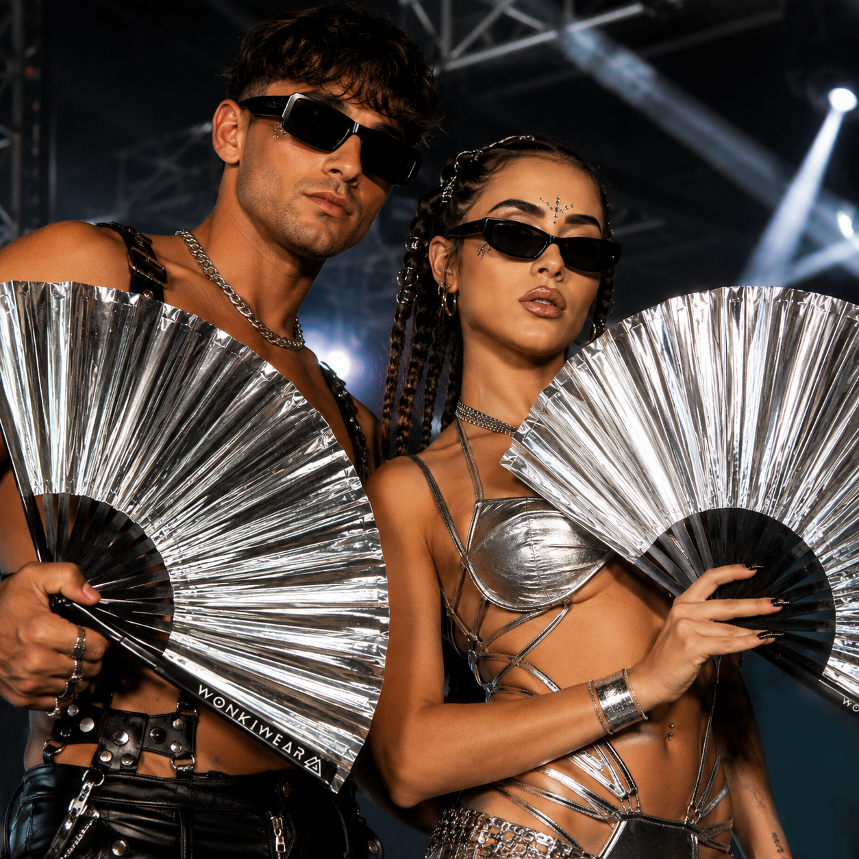 Festival group using WonkiWear metallic silver XL hand fans