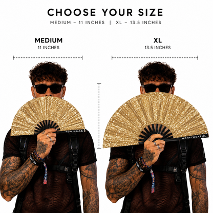 Size comparison of medium and XL gold glitter festival fans held by model