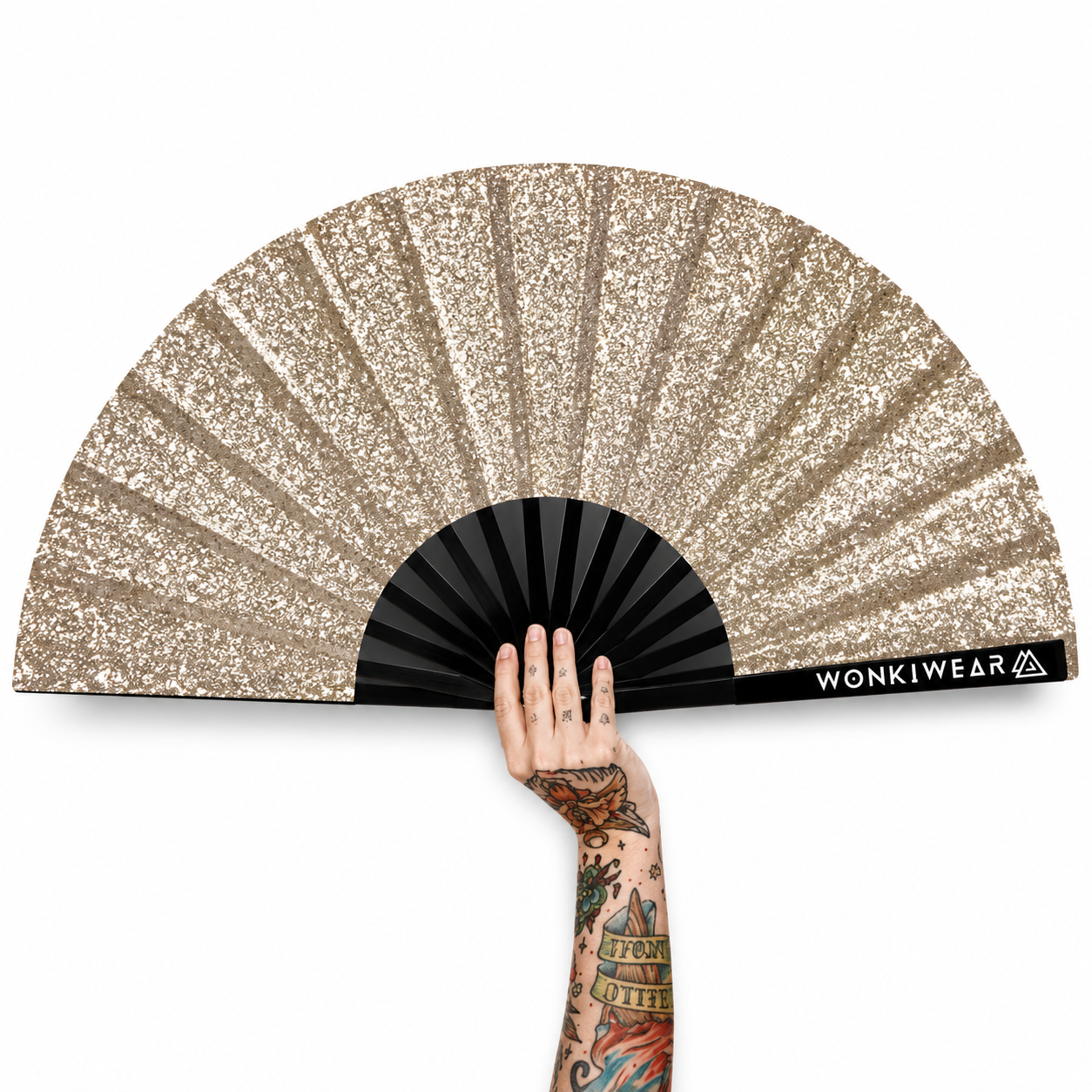 Gold glitter folding festival fan with tattooed hand on white background