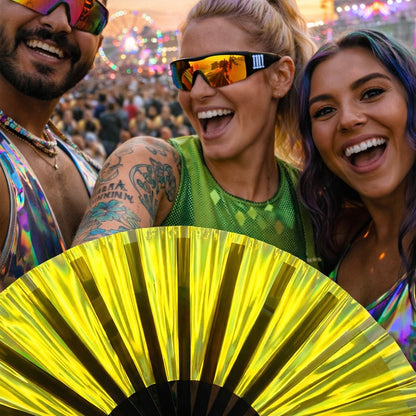 Close up of gold iridescent rave fan with reflective shine at festival