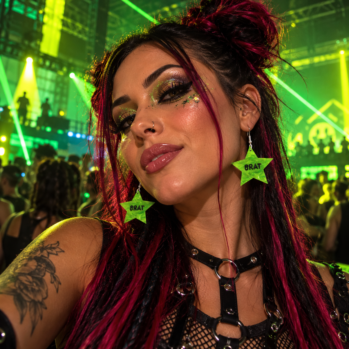 Woman wearing green BRAT star drop earrings at a vibrant neon rave