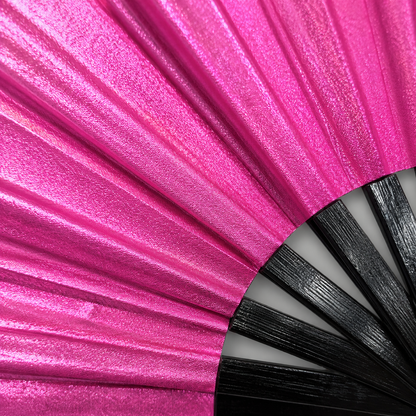 Close-up showing metallic hot pink shimmer texture on WonkiWear XL festival fan