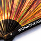 Close up of iridescent festival fan with WonkiWear logo and holographic material detail