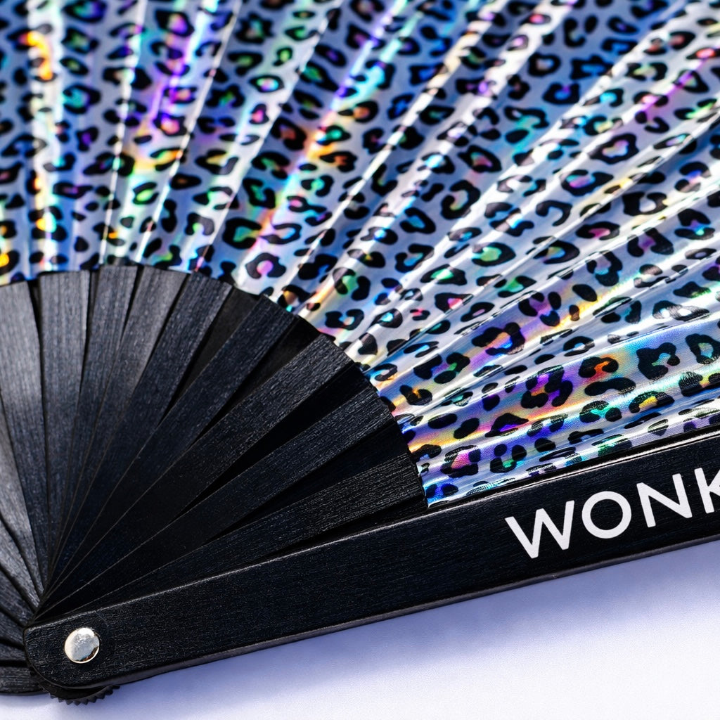 Detailed view of iridescent leopard fan material and strong black ribs WonkiWear